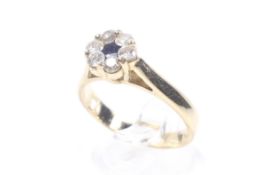 A vintage sapphire and diamond cluster ring.