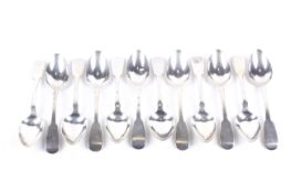 A set of twelve early Victorian silver fiddle pattern dessert spoons.