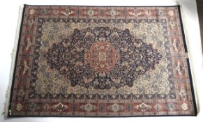 A blue ground rug with red and cream details.