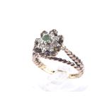 A vintage 9ct gold, emerald and diamond cluster ring.