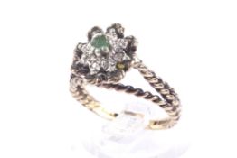 A vintage 9ct gold, emerald and diamond cluster ring.