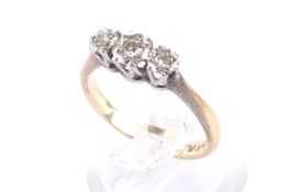 A mid 20th century gold and diamond three stone illusion ring.