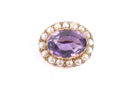 A Victorian gold, amethyst and half-pearl oval cluster brooch.