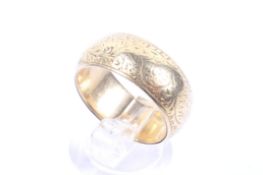 A late Victorian 18ct gold broad wedding band.