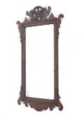 A Georgian fretwork wall mirror.