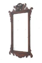 A Georgian fretwork wall mirror.