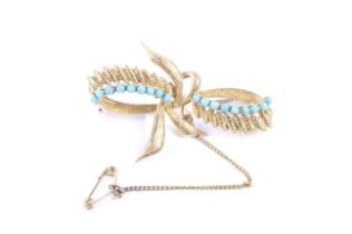 A vintage Italian gold and turquoise brooch in the form of a stylised textured-leaf ribbon-tied bow.