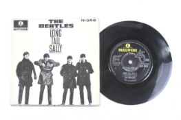A Beatles 'Long Tall Sally' vinyl single record with the signatures of all four band members.