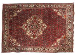 An Orico Persian style silk rug.