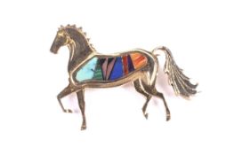 A vintage American '14K' and intarsia set horse brooch.