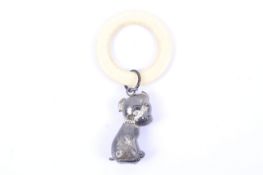 A silver 'Bonzo the dog' baby's rattle and composition teething ring.