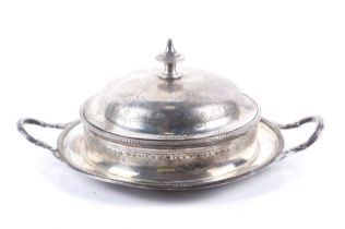 A Victorian silver round butter dish and cover.