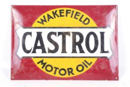 A vintage enamel advertising sign for 'Castrol Motor Oil'.
