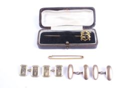 A small collection of gold jewellery including two pairs of cufflinks.