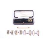 A small collection of gold jewellery including two pairs of cufflinks.