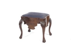 A burr walnut upholstered stool.Carved ball and claw feet to cabriole legs,to a blue upholsted seat.