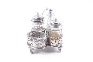 A late Victorian silver four piece cruet set and stand.