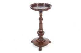 A 19th century rosewood plant stand.