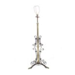 A late Victorian Arts and Crafts telescopic standard lamp.