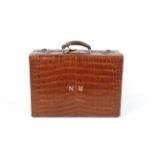 A early 20th century gentleman's alligator skin travelling suitcase.