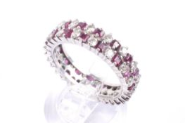 A modern ruby and diamond two-row eternity ring,