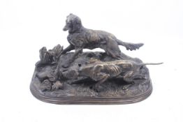 A bronze sculpture showing dogs hunting a pheasant. Signed 'P.J. Mene', L39cm.