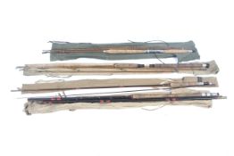 A collection of spinning and Float fishing rods.