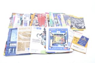 A mixed collection of football programmes.