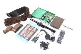 A collection of various shooting related items. To include a cartridge belt, a set of .