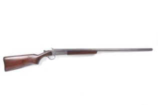 A Cooey model 94 single barrel 12 gauge shotgun.