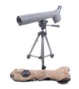 A Kowa sight scope and tripod. In grey, complete with a sheepskin cover.
