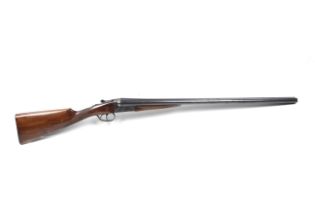 An AYA 12 gauge side by side box lock shotgun.
