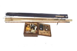 An assortment of fly-tying equipment and two rods.