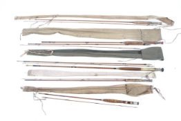 Five unbranded fixed spool and fixed pin fly fishing rods.