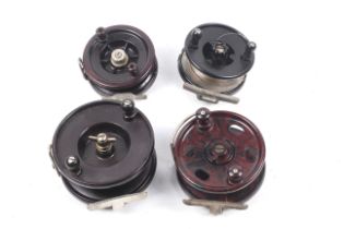 Four vintage 'Bakelite' centre pin fishing reels.