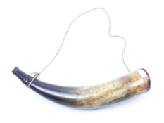 A powder horn. Constructed from a cows horn with a carved spout complete with string, H38cm.