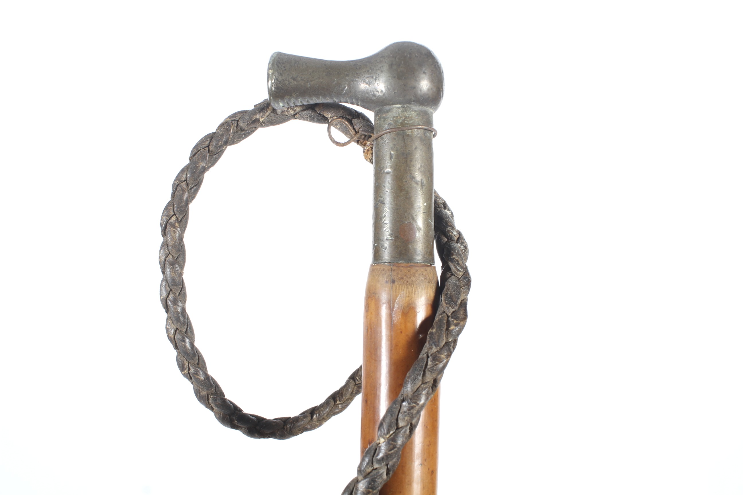 A Malacca Riding crop. With a brass handle and braided leather tail, L75cm. - Image 2 of 2