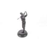 A bronze sculpture of a golfer on marble base. Shown finishing his swing, H33cm.