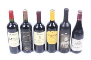 Six bottles of red wine.Moueix 2010 75cl 13.5%.Los Condes 750ml,1 3.5%.