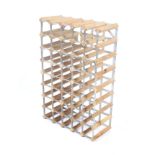 A metal framed pine wine rack. With capacity for 50 bottles, H80cm x W52cm.