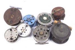 A collection of eight vintage fishing reels.