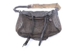 A waxed game keeper's bag. In brown with netting and canvas handle.