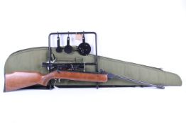 A Diana model 79 break barrel air rifle. .22 calibre sold with slip case and black metal target.