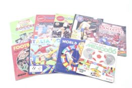 A collection of nine Panini sticker albums.