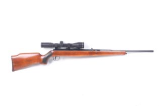 An Orieinal underlever air rifle. .22 calibre with tap loading and fitted with SMK 4-12x42 and slip.