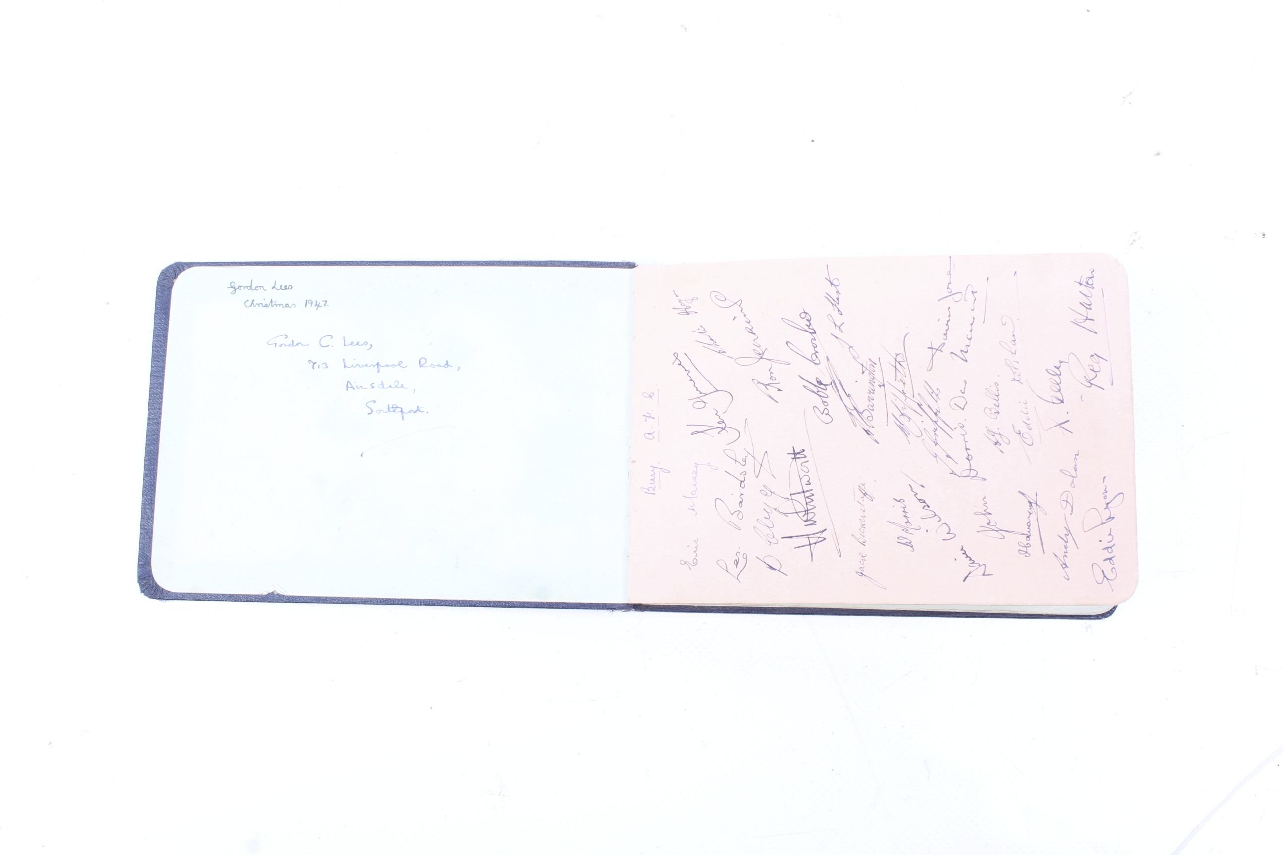 A navy blue bound autograph book containing sporting related autographs form the 1940s/50s.