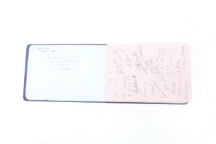 A navy blue bound autograph book containing sporting related autographs form the 1940s/50s.