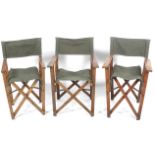 Three teak crossover folding chairs.