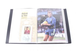 A collection of Football autographs in an album.