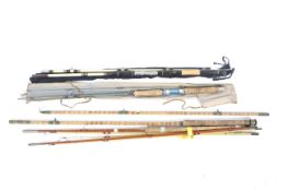 A collection of vintage and modern fishing rods.